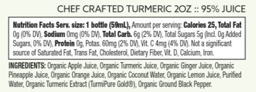 Suja Turmeric Shot bottle surrounded by fresh turmeric, ginger, and other natural ingredients